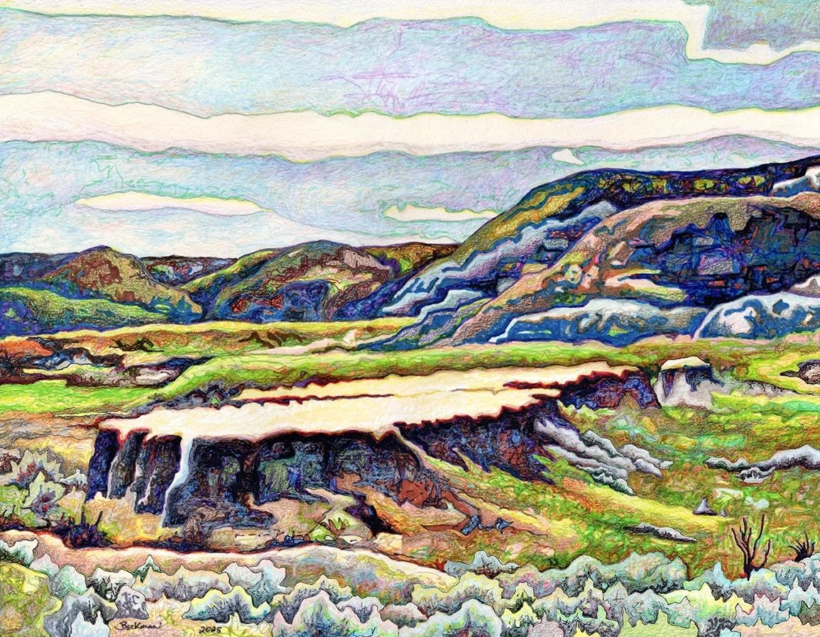 Badlands flat-top mesa with colorful hills 