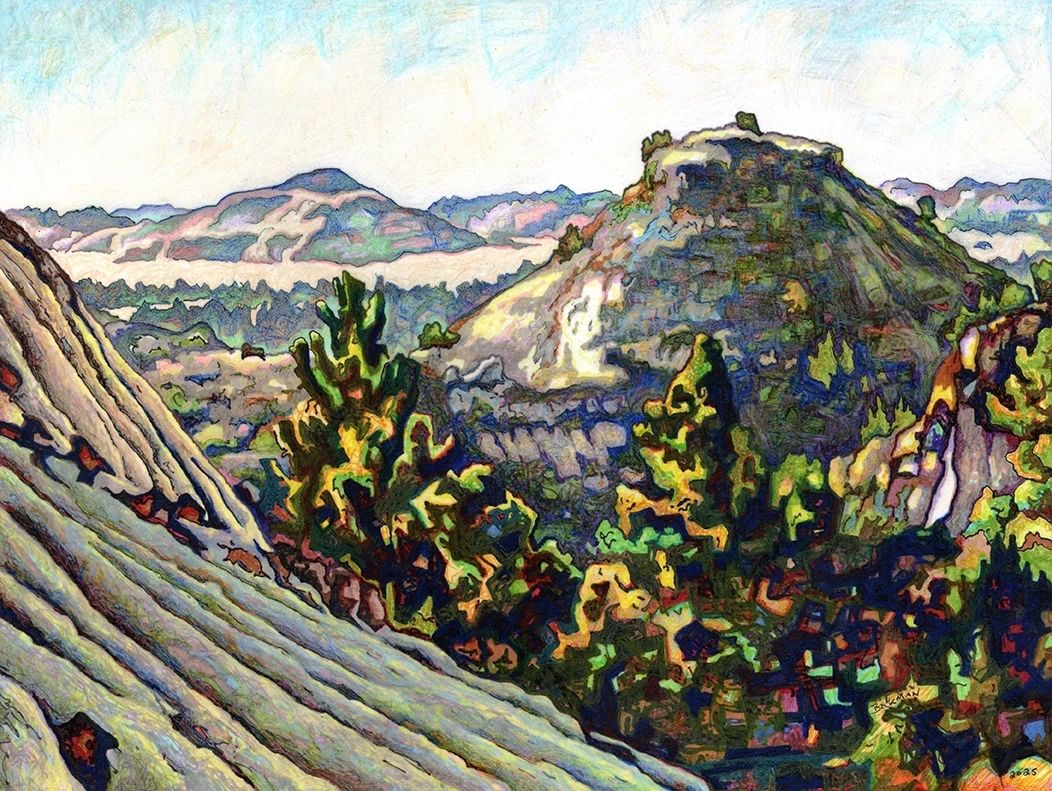 Badland's view of erosion, sparce vegetation distant hills.